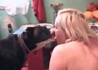 Lovely babe is kissing a beast